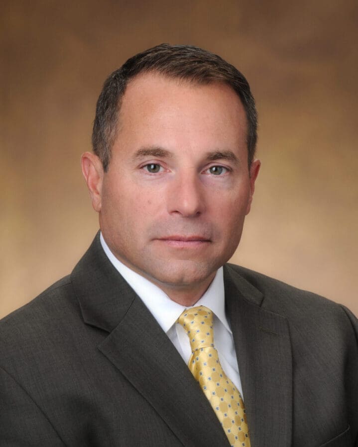 A man in suit and tie posing for the camera.